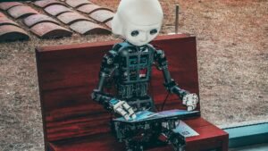 black and white robot toy on red wooden table